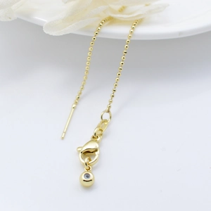 Gouden kralenketting met karabijnsluiting en blauwe Evil Eye bedel accessoire