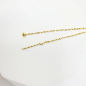 Minimalist gold chain earrings with mushroom head bead and linear pin on white background