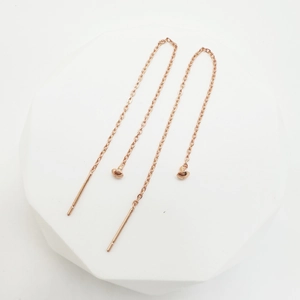 Minimalist rose gold chain threader earrings with round bead and bar on white stand