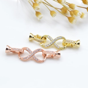 Infinity jewelry clasps in gold and rose gold with micro-pave cubic zirconia accents