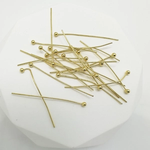 Polished 18k gold plated copper ball head pins for jewelry making on white stand