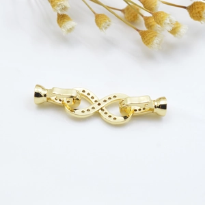 Polished gold infinity jewelry connector clasp with decorative punch holes for DIY necklaces