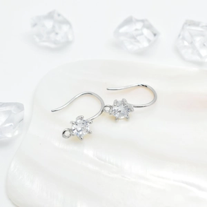 Elegant silver hook earrings with round brilliant cubic zirconia stones in 45-degree view