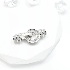 Polished silver clasp with pavé crystals for pearl necklace jewelry making on display