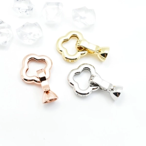 Three-color floral jewelry clasps in gold, silver, and rose gold with flower design