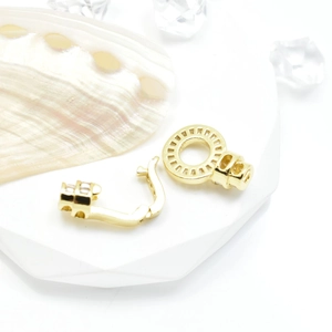 Polished 18k gold plated necklace connector with gear texture and pearl accents