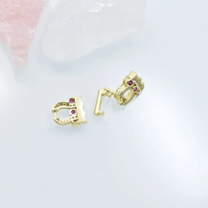 Gold plated earring with red gemstone and cubic zirconia in a geometric hollow design
