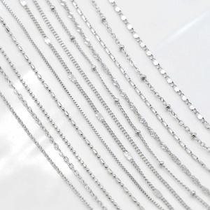 Selection of silver-plated chains including bead, snake, and cable styles on white background