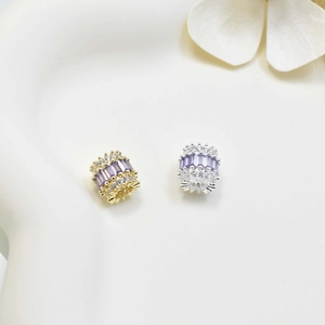 Gold and silver cylinder barrel beads with purple zircon and sparkling crystals