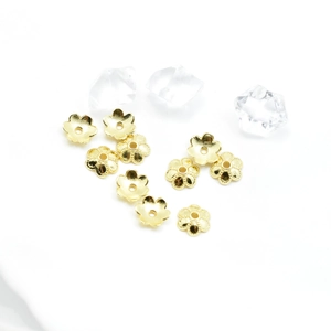 Detailed view of 5-petal gold flower bead caps for DIY jewelry making accessories