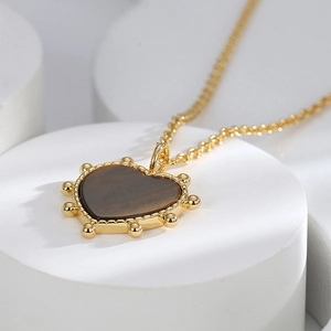 Retro tiger eye heart pendant necklace in gold finish with delicate cross chain for women