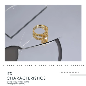 Detailed view of vintage gold-plated rotating flower ring with cubic zirconia