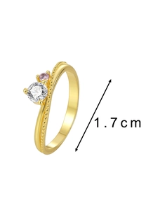 Detail showing wavy 18K gold ring with clear and pink zircon stones and 1.7cm diameter