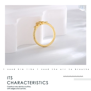 Close-up of gold clover ring with micro-set zircon and textured 18K plated finish