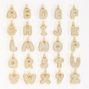 Gold plated bubble letter pendants set with iced out cubic zirconia for hip hop jewelry