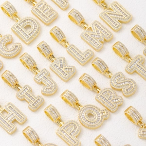 18k gold plated alphabet pendant collection with CZ stones in a diagonal layout