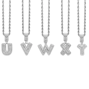 Detailed display of iced out silver letter pendants U to Y with sparkling zircon stones