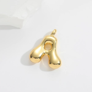 Macro shot of gold bubble alphabet A pendant with high mirror polish and round edges