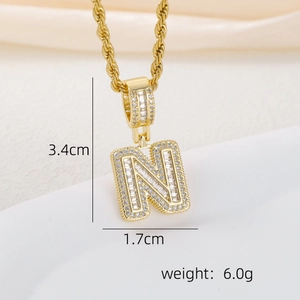 Detail view of gold letter N pendant with zircon stones showing dimensions 3.4cm by 1.7cm