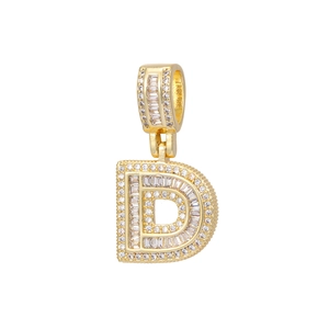 Detail of 18k gold letter D pendant with baguette and round cut cubic zirconia