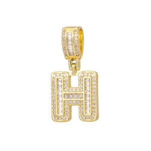 Macro view of 18k gold plated letter H pendant with pavé cubic zirconia crystals