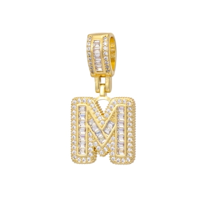 Detailed close-up of 18k gold plated letter M pendant with sparkling zircon micro-pave