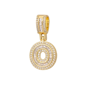 Detail of 18k gold plated round alphabet pendant with baguette and round cut stones