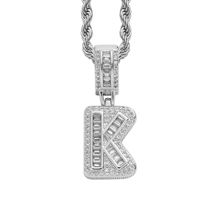 Silver iced-out letter K pendant with baguette and round stones on rope chain