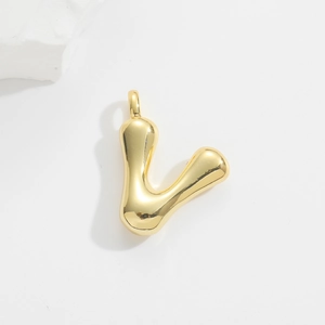 Detailed view of a puffy gold balloon-style letter V pendant with a polished shiny finish