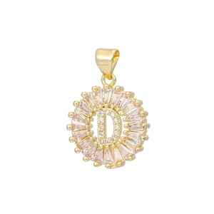 Macro detail of 18k gold plated letter D pendant with baguette and round cut crystals