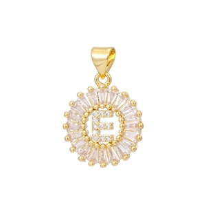 Detail macro view of 18k gold plated letter E pendant with sparkling baguette zircons
