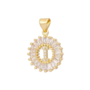 Macro view of gold-plated letter I pendant with baguette and round-cut cubic zirconia