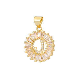Macro shot of 18k gold plated letter J pendant with baguette cut zircons and sunburst design