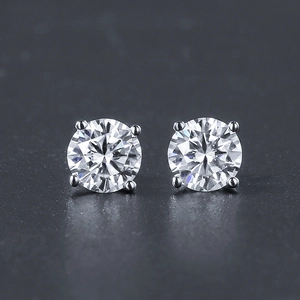 Detailed view of round brilliant-cut micro-pave cubic zirconia earrings in four-prong setting