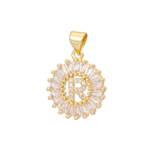 Detail of 18k gold plated letter R pendant with baguette cut crystals and micro pave