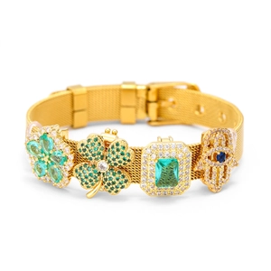 Golden 10mm mesh strap bracelet featuring emerald green charms and Evil Eye pendant