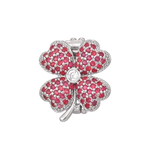 Detailed view of the four-leaf clover charm with red pavé stones and center zircon