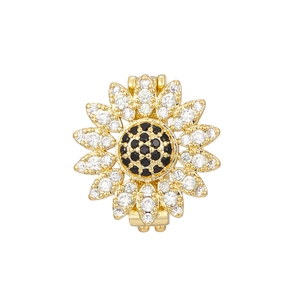 Detailed macro view of sunflower pendant with pavé-set crystals and black center stone