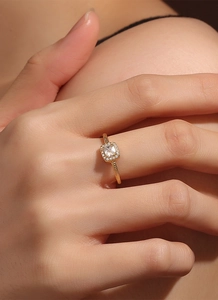 Detailed view of a gold-plated halo ring featuring a square zircon and beaded texture