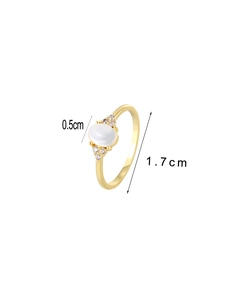Macro detail of vintage gold ring with oval white gemstone and measurement indicators