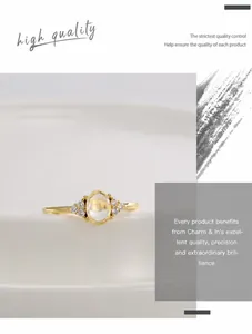 Detailed close-up of a vintage gold ring featuring a large oval translucent gemstone