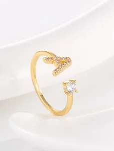 Detail of 18K gold plated ring featuring a zircon-encrusted letter A and round stone