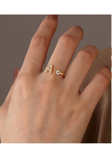 Detailed close-up of adjustable 18K gold-plated ring featuring zircon-inlaid letter A