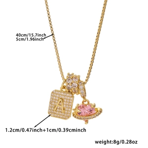 Golden necklace with cubic zirconia square letter A and pink heart planet pendants