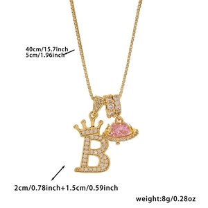 Detail view of gold crown letter B pendant with pink heart Saturn charm and dimensions