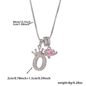 Detail of silver crown letter O pendant with pink heart planet charm and size specs