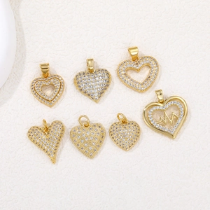 Detailed close-up of 18K gold-plated heart pendants with micro-pave cubic zirconia stones