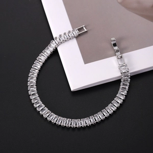 Polished silver-plated tennis bracelet with baguette-cut sparkling cubic zirconia stones
