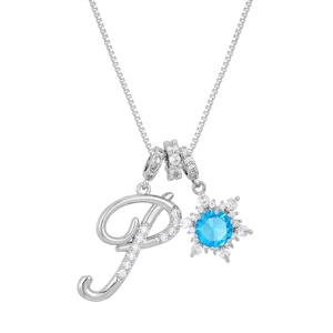 Macro detail of silver box chain with crystal letter P and blue zircon snowflake pendant