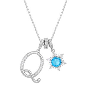Detailed close-up of silver letter Q pendant with blue zircon snowflake charm